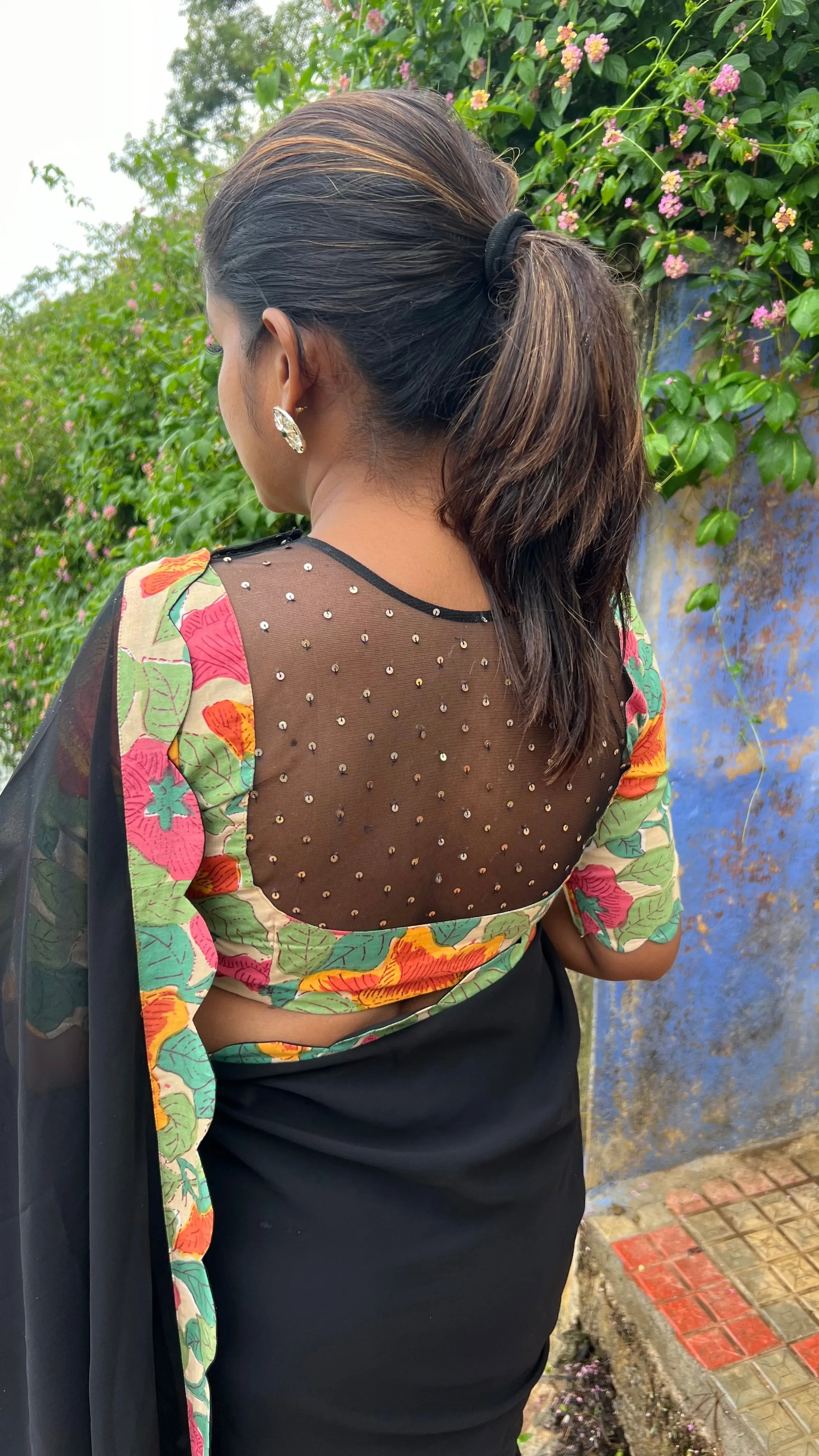 Black georgette saree with floral cotton blouse