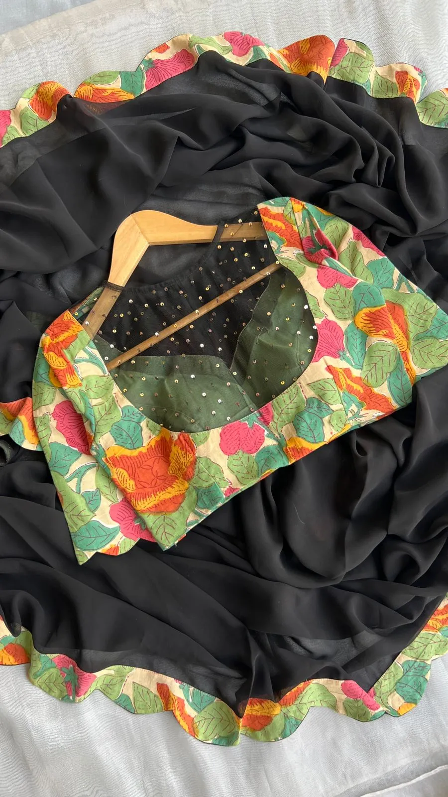 Black georgette saree with floral cotton blouse