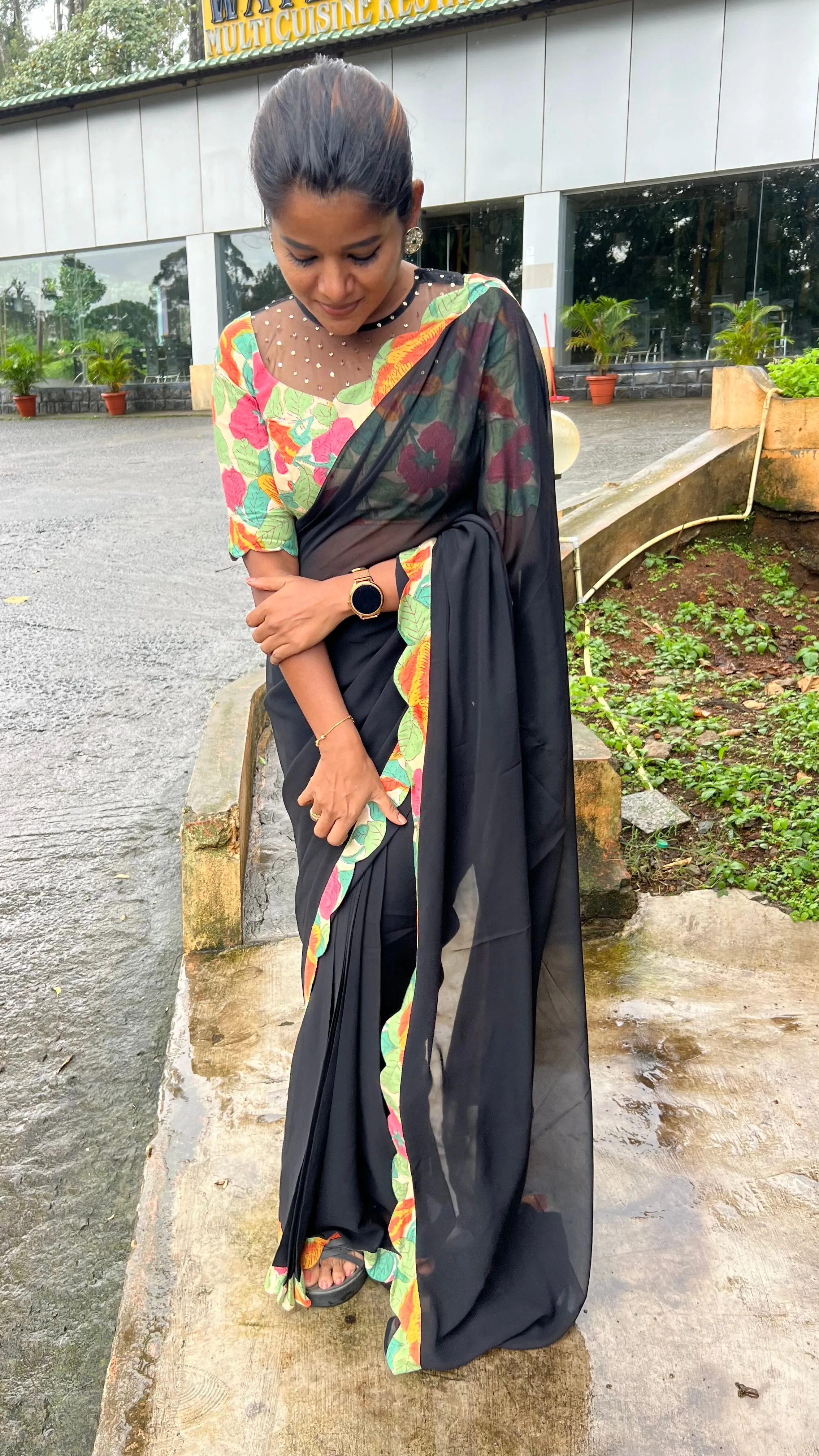 Black georgette saree with floral cotton blouse