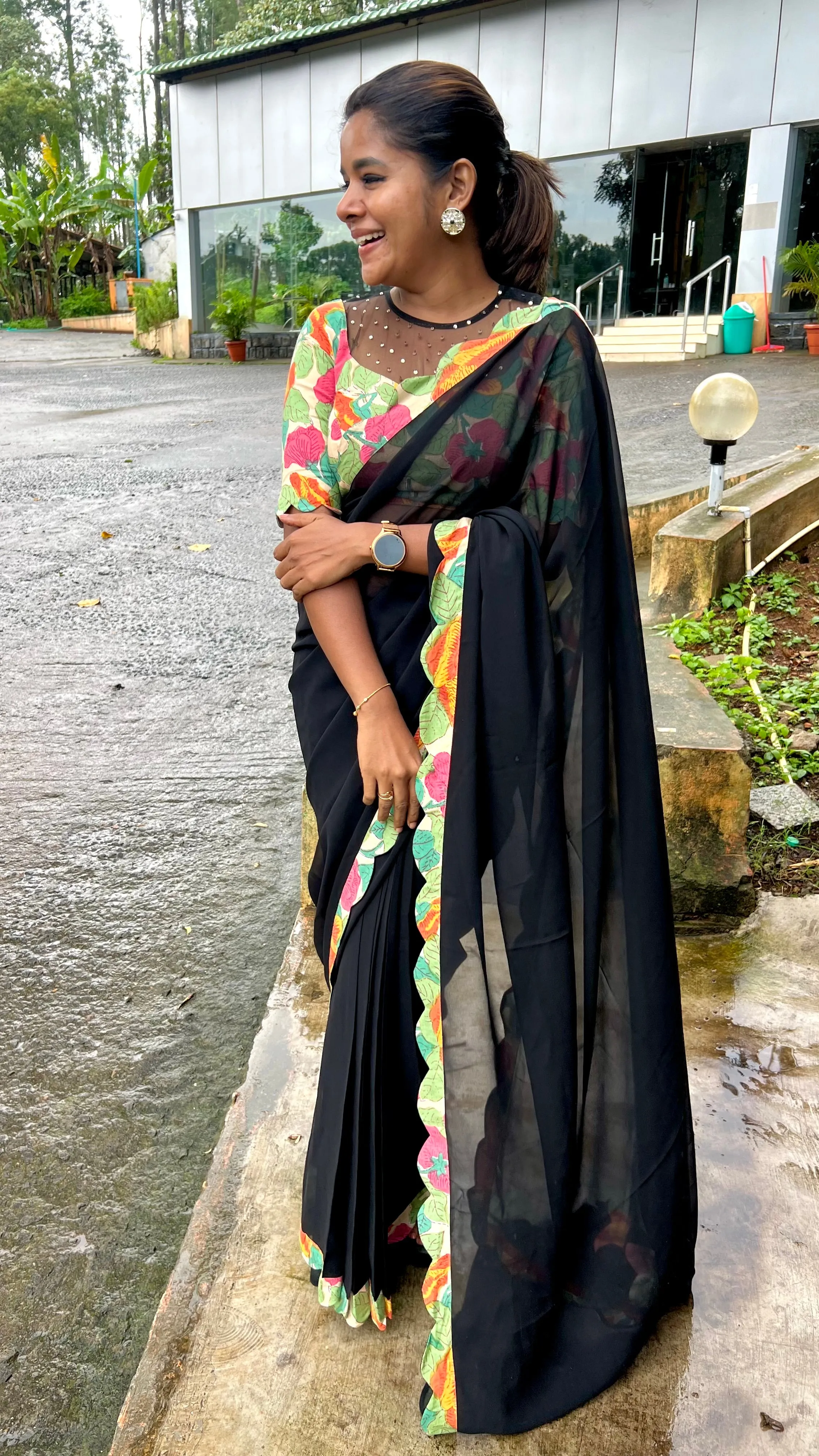 Black georgette saree with floral cotton blouse