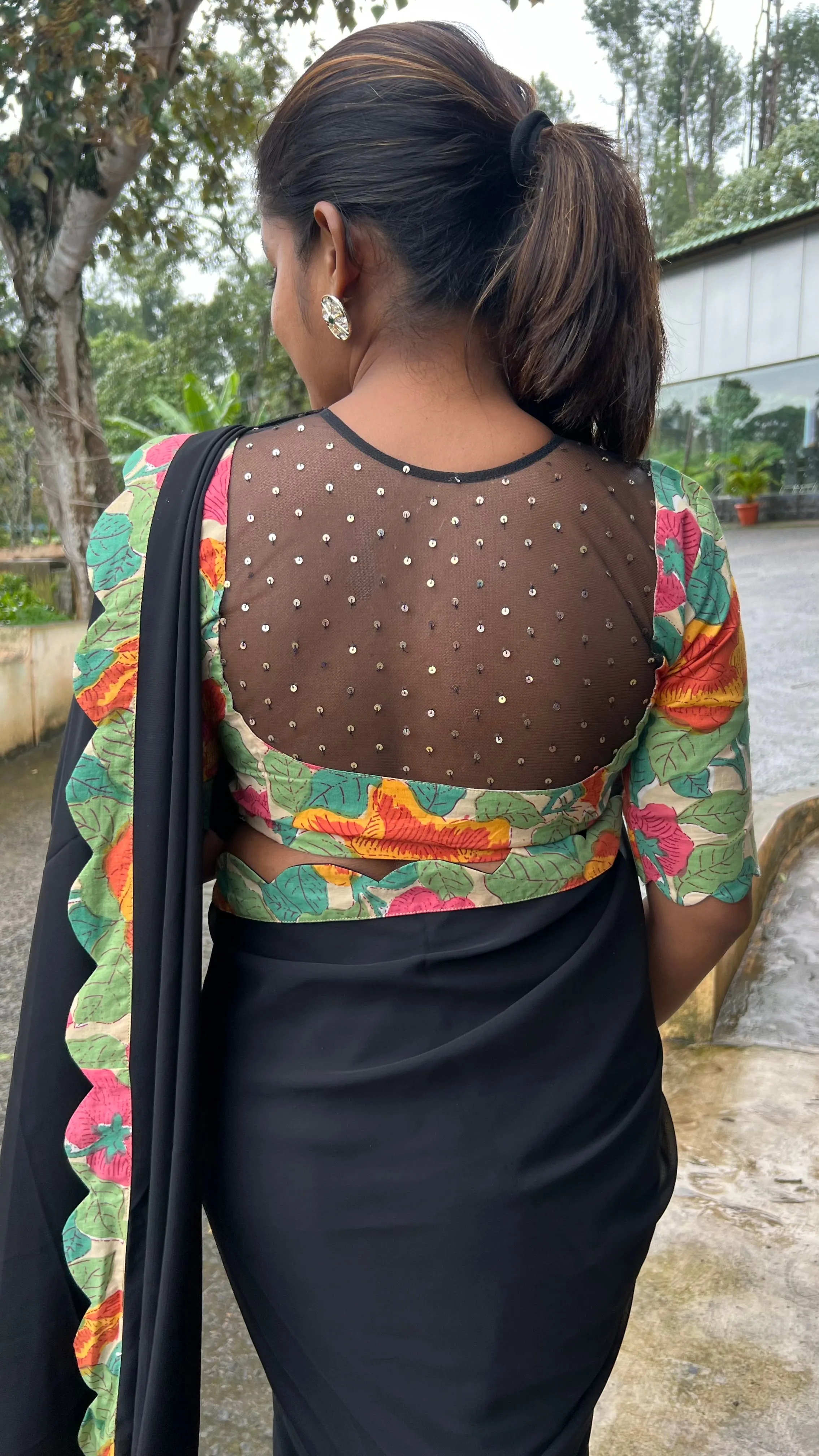 Black georgette saree with floral cotton blouse