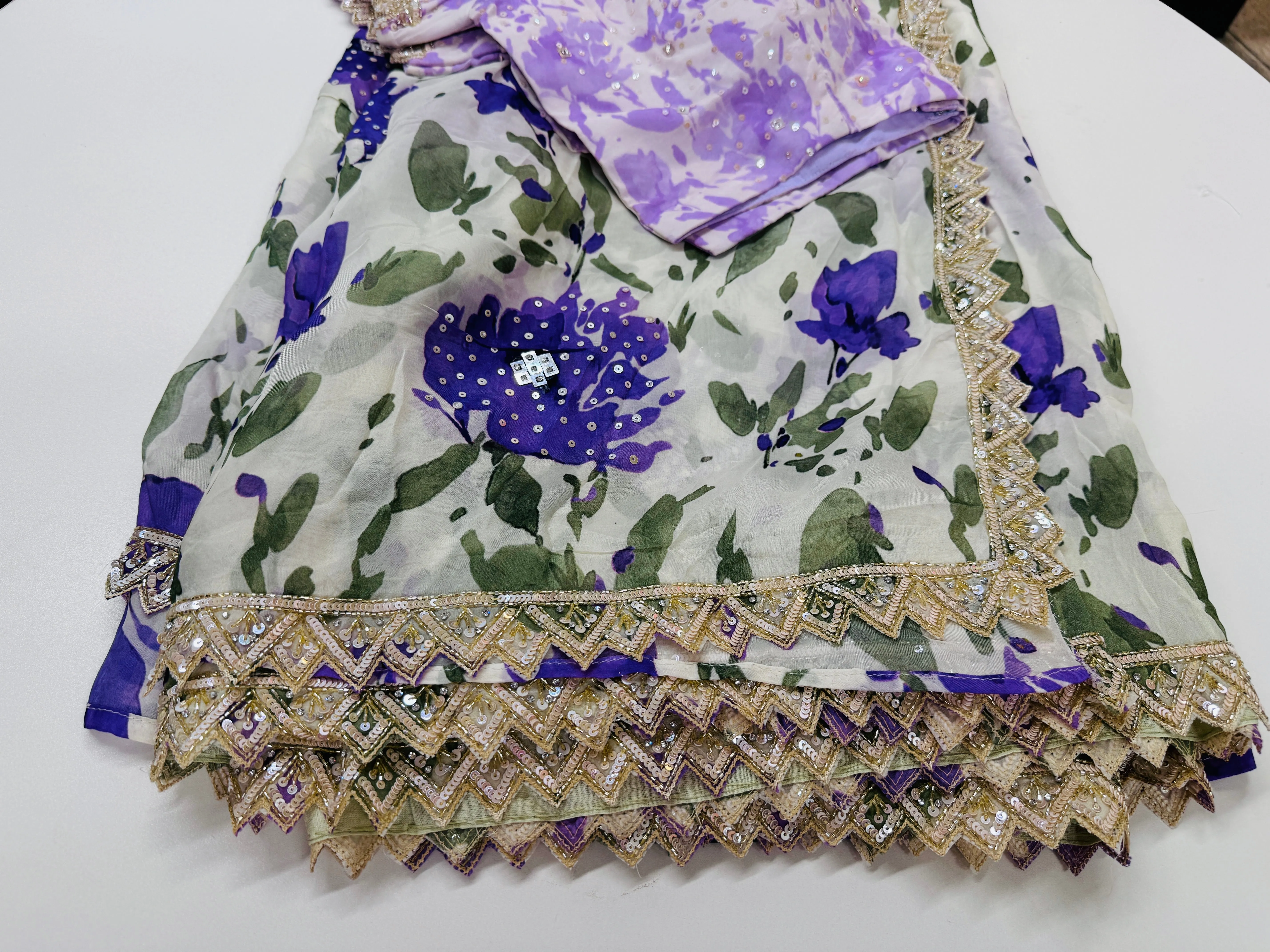 Off white purple printed Georgette saree with stitched blouse