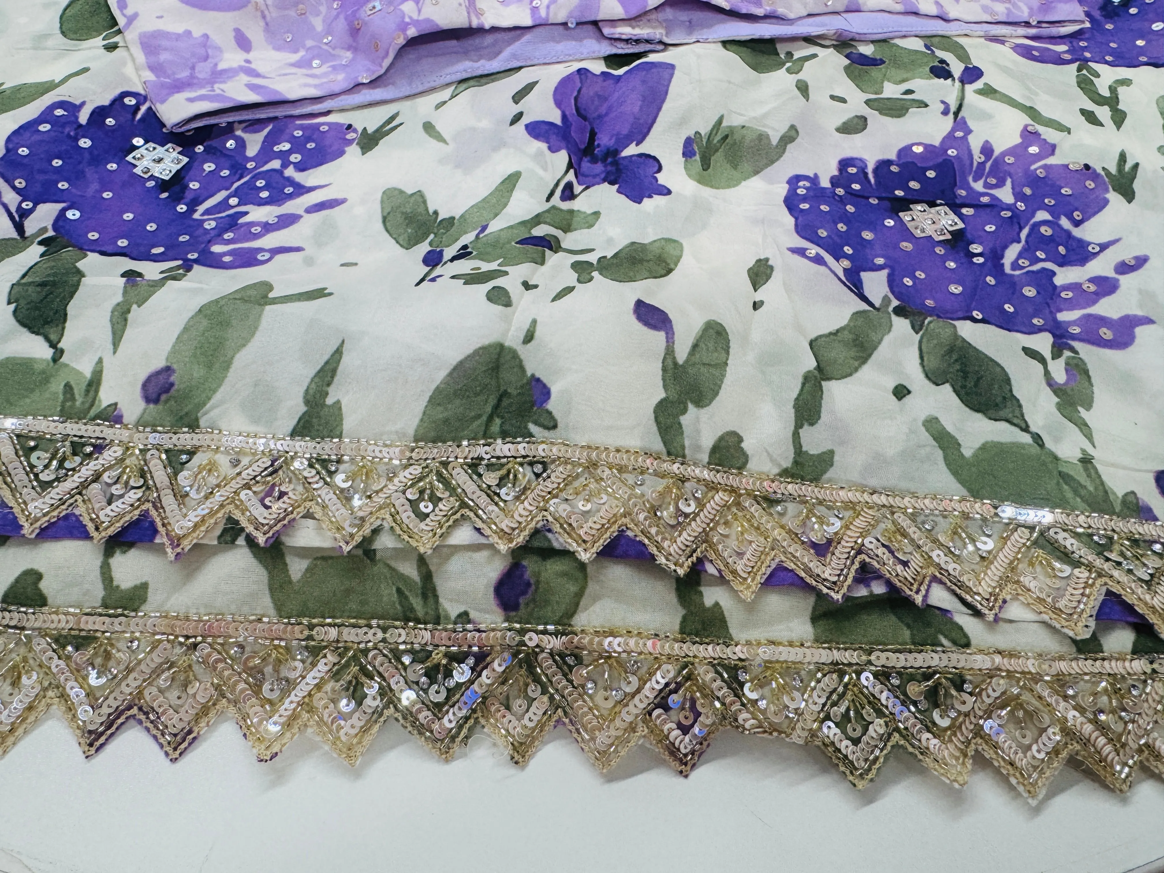 Off white purple printed Georgette saree with stitched blouse