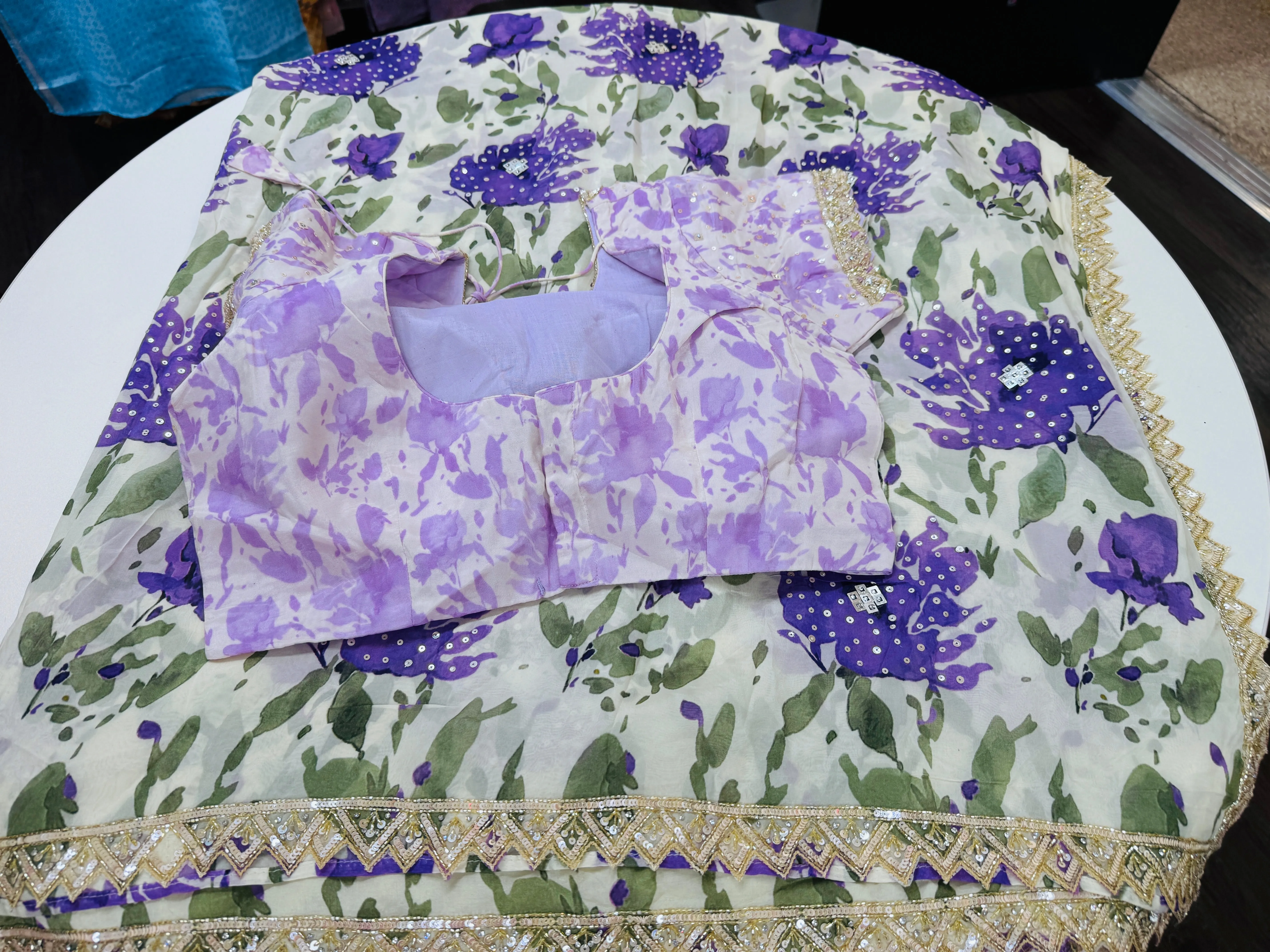 Off white purple printed Georgette saree with stitched blouse