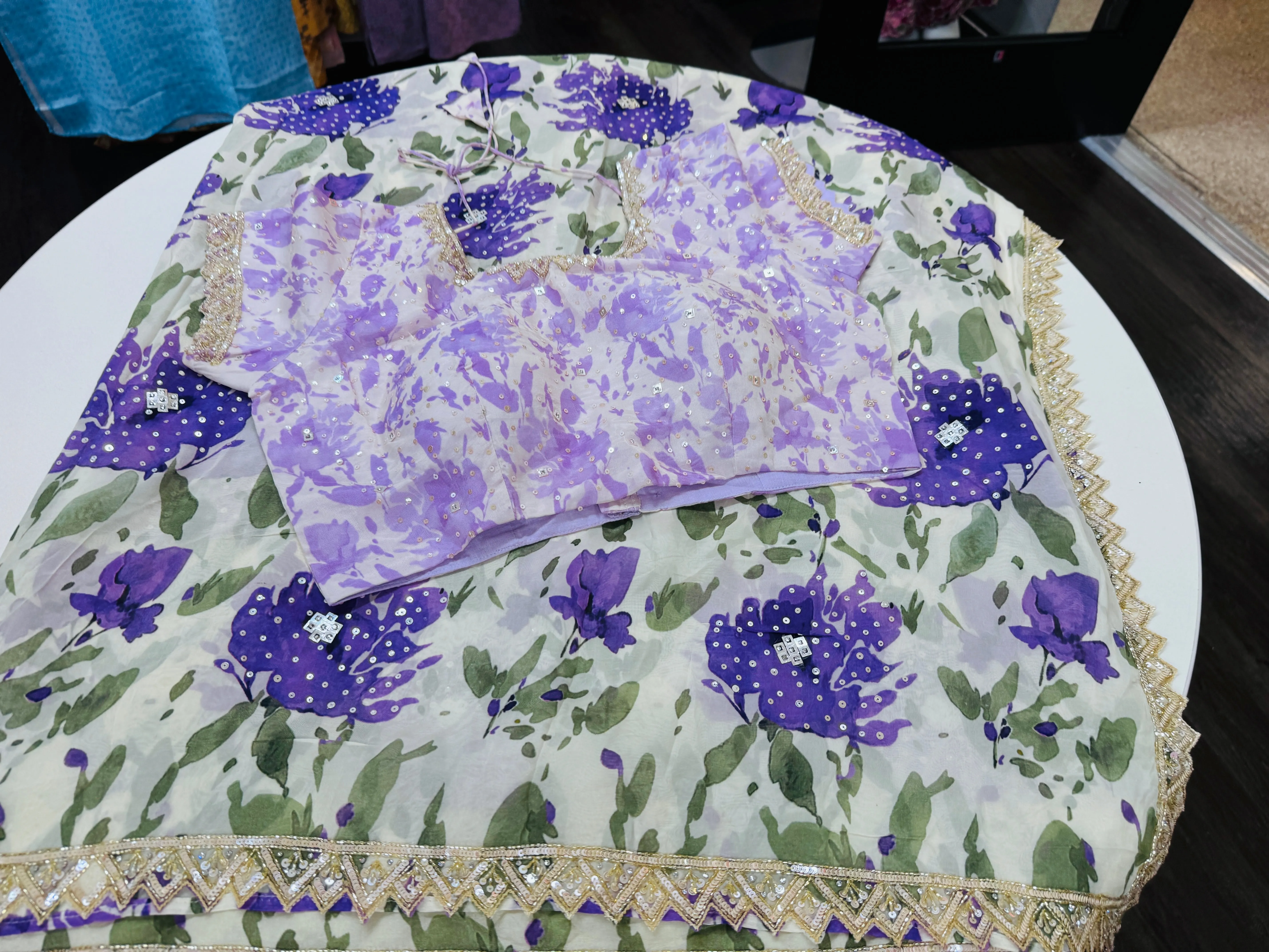 Off white purple printed Georgette saree with stitched blouse
