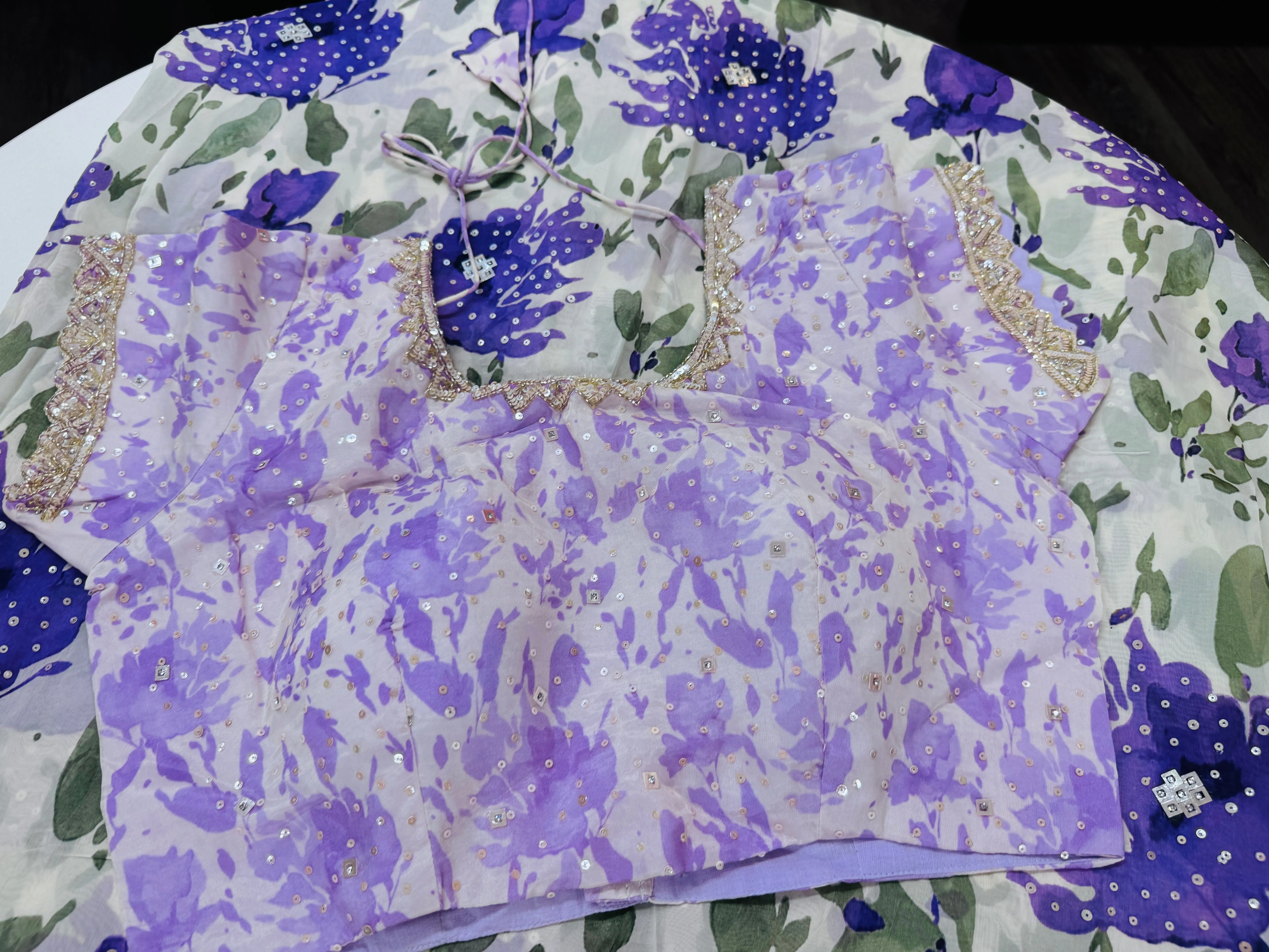 Off white purple printed Georgette saree with stitched blouse